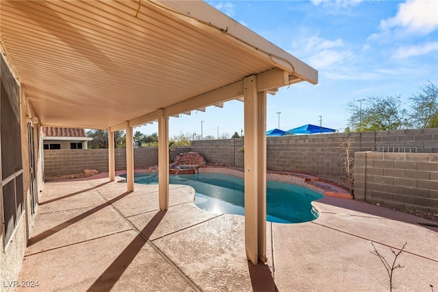 view of pool featuring a patio