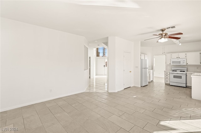 unfurnished living room with ceiling fan and light tile patterned floors