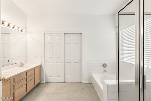 bathroom featuring separate shower and tub, vanity, and tile patterned floors