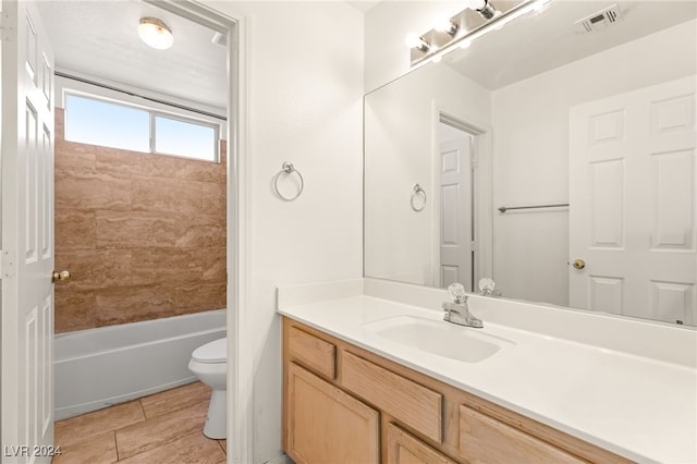 full bathroom with shower / bathtub combination, tile patterned floors, vanity, and toilet