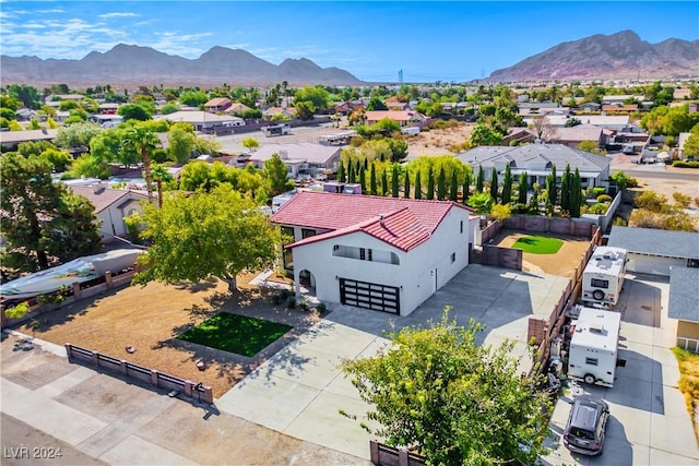 birds eye view of property with a mountain view