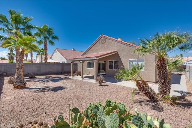 back of property featuring a patio area