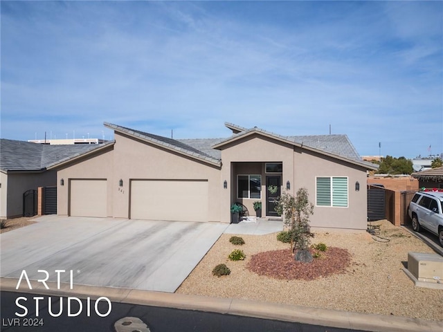 ranch-style house featuring a garage