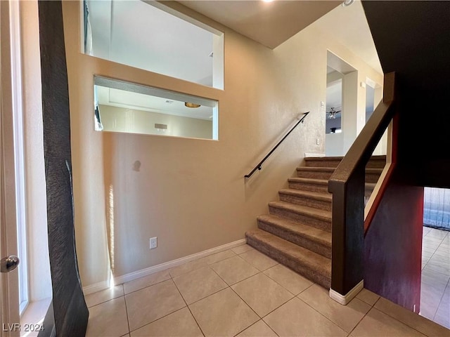 stairway featuring tile patterned floors