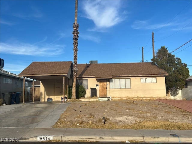 view of front facade with a carport