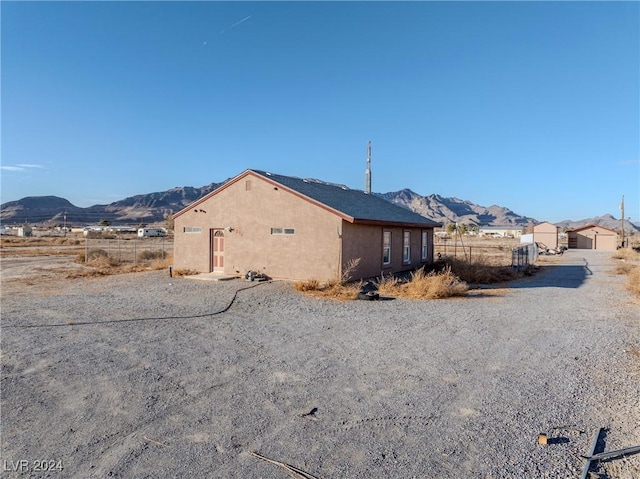 view of side of property featuring a mountain view