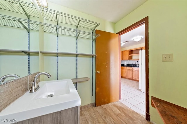 bathroom with vanity and hardwood / wood-style flooring