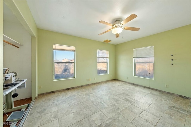 spare room with ceiling fan