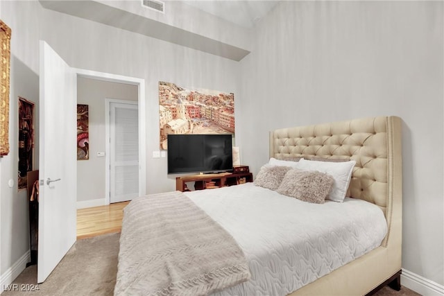 bedroom with wood-type flooring