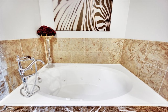 bathroom featuring tiled tub