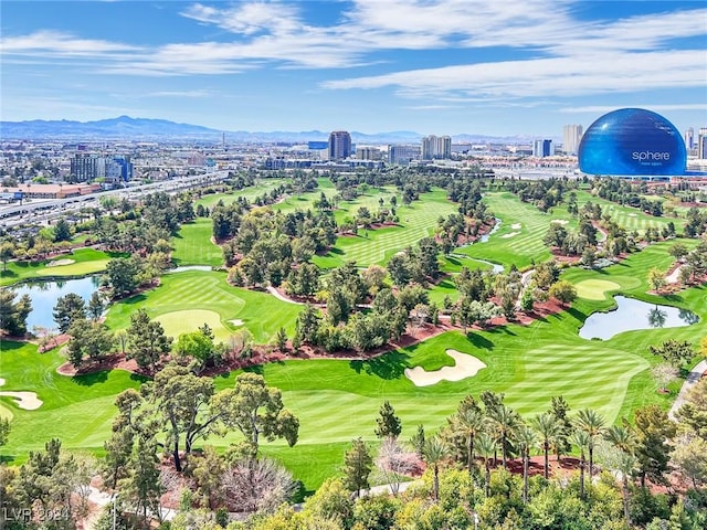 birds eye view of property with a water and mountain view