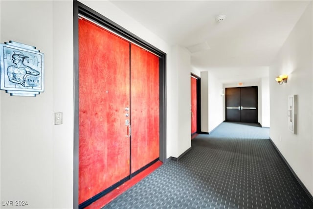 hallway featuring carpet flooring