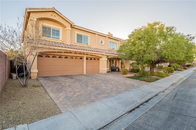 mediterranean / spanish-style house featuring a garage