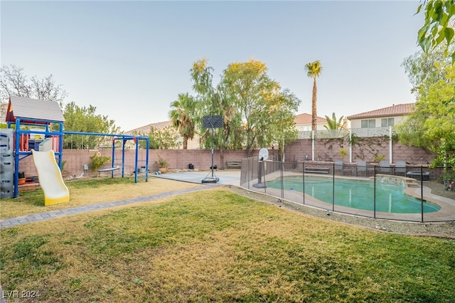 exterior space with a yard, a fenced in pool, and a patio