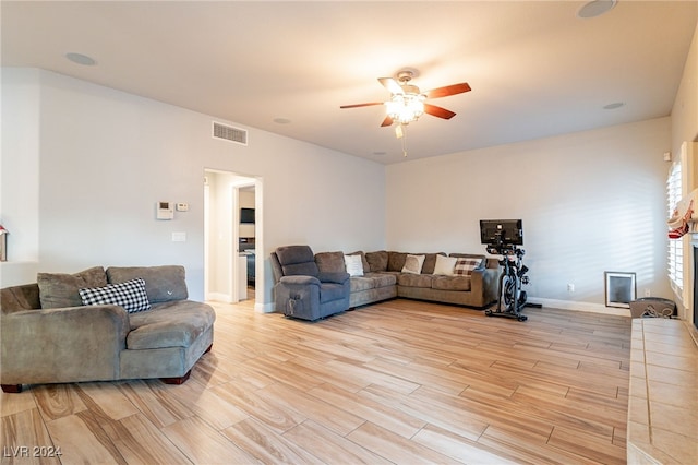 living room with ceiling fan and light hardwood / wood-style floors