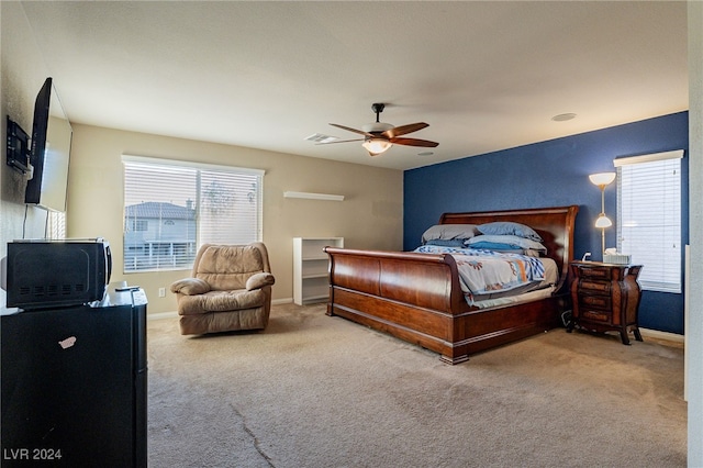 bedroom featuring ceiling fan and carpet floors