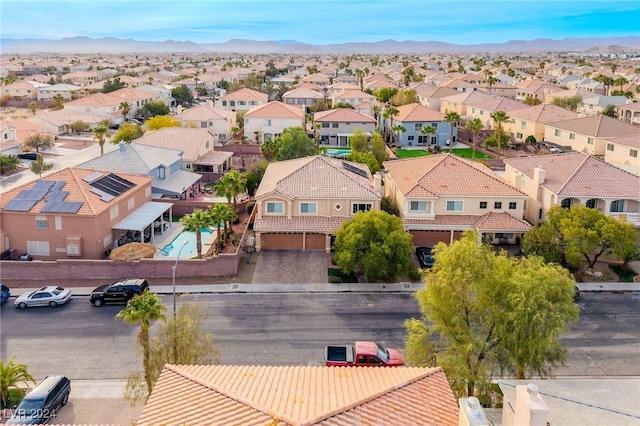 birds eye view of property with a mountain view