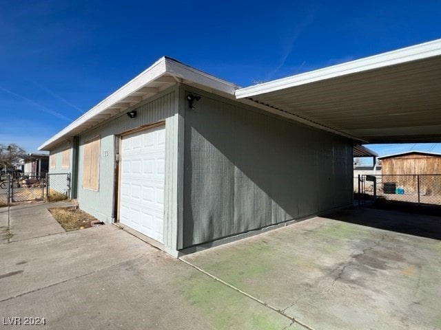 view of side of property with a carport