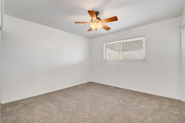 spare room with light carpet and ceiling fan