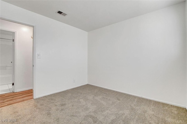 unfurnished room with carpet floors