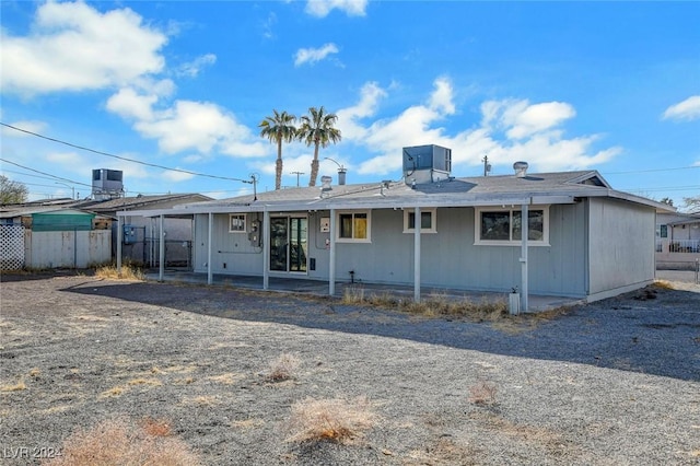 back of property with central AC unit