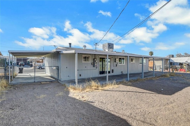 rear view of house with a carport