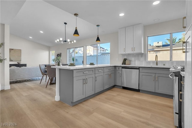 kitchen featuring gray cabinets, a wealth of natural light, and dishwasher