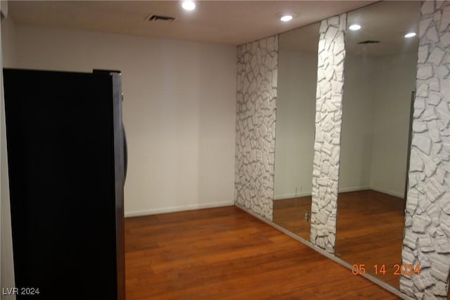 empty room featuring hardwood / wood-style flooring