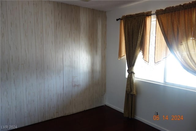 empty room with wooden walls