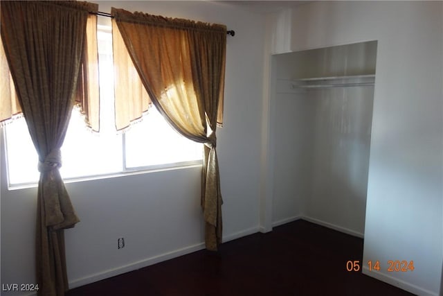 unfurnished bedroom with a closet