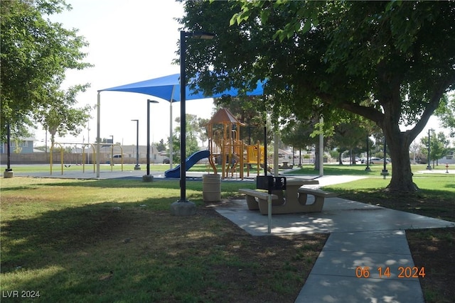 view of community with a playground and a yard