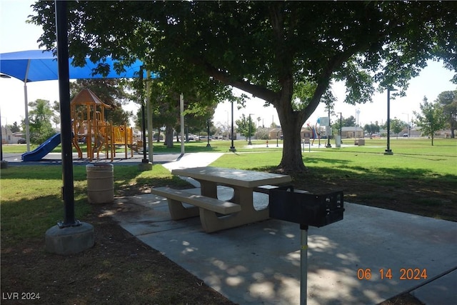 view of property's community featuring a playground and a yard