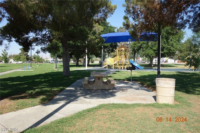 surrounding community with a playground and a yard