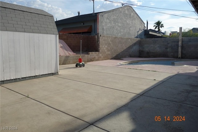 view of patio / terrace with a fenced in pool