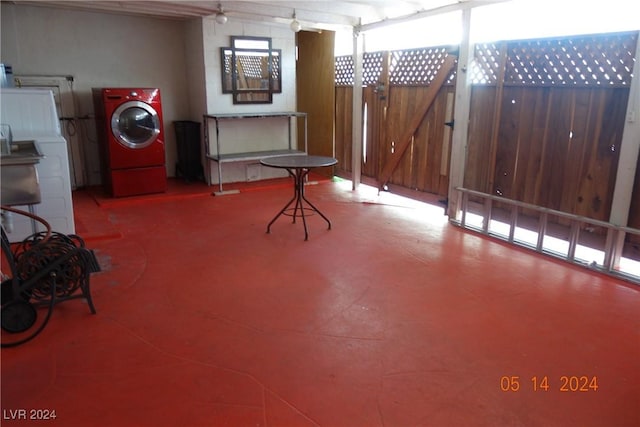 interior space featuring washer / clothes dryer, ceiling fan, and plenty of natural light