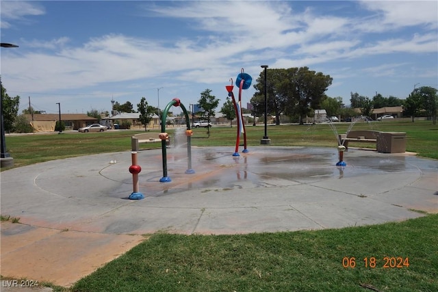 view of home's community with a yard