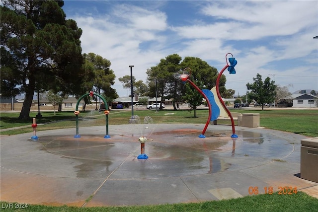 view of playground featuring a lawn