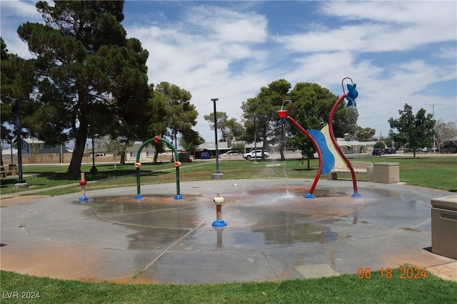 view of jungle gym with a lawn