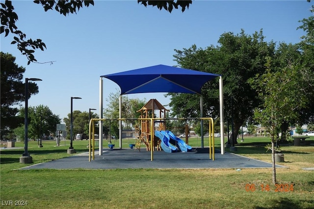 view of playground with a yard