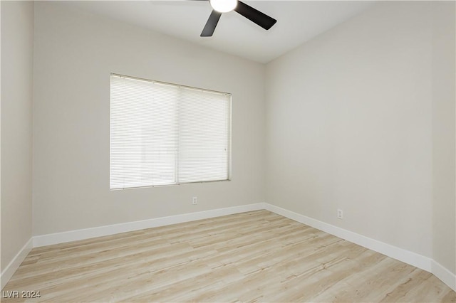 empty room with ceiling fan and light wood-type flooring