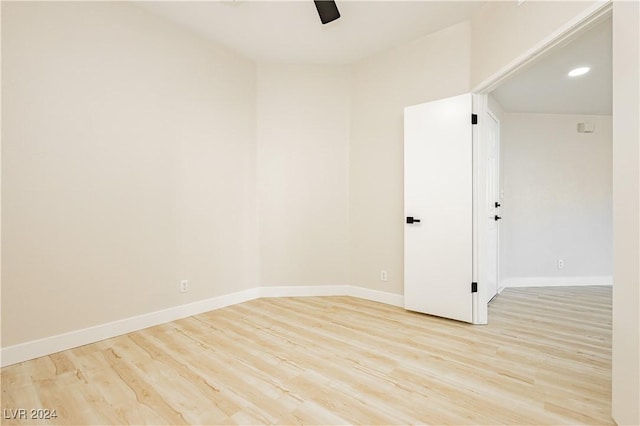 unfurnished room with ceiling fan and light wood-type flooring