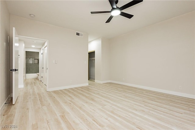 unfurnished room with light hardwood / wood-style flooring and ceiling fan