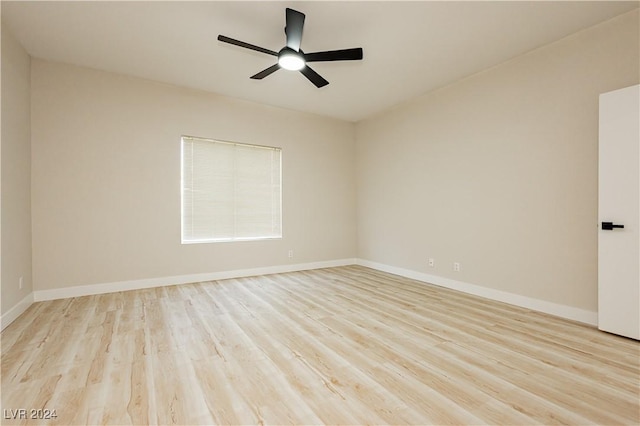 unfurnished room with ceiling fan and light wood-type flooring