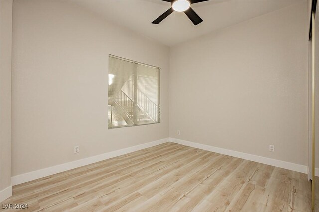 unfurnished room with light hardwood / wood-style flooring and ceiling fan