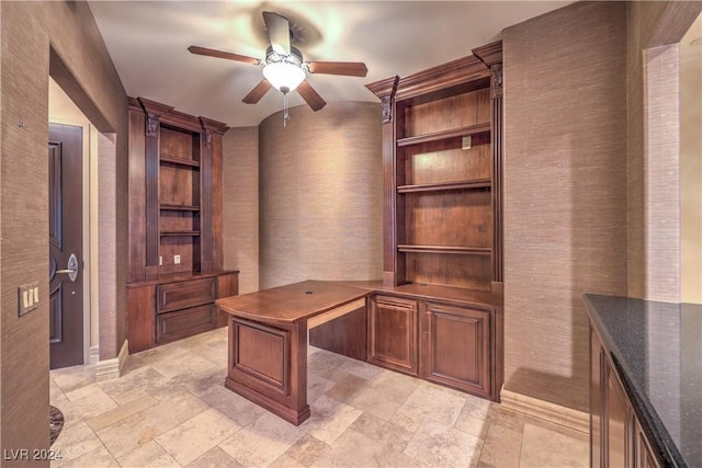 unfurnished office featuring ceiling fan