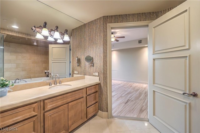 bathroom with ceiling fan, tile patterned floors, and vanity