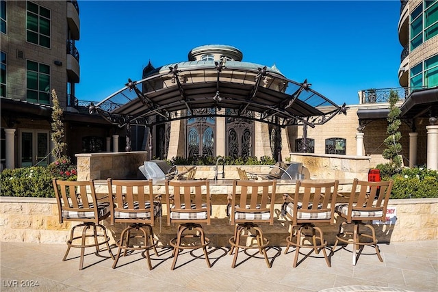 view of patio featuring a grill and an outdoor kitchen