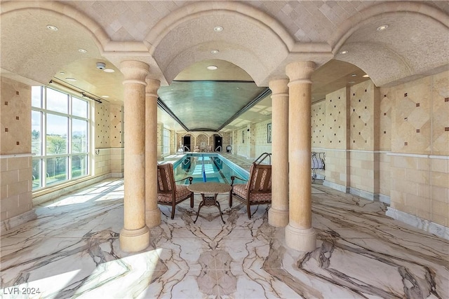 view of patio / terrace with an indoor pool