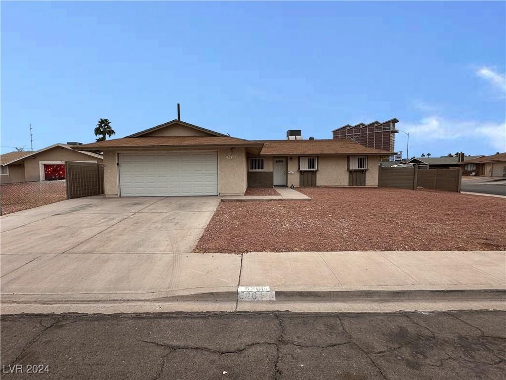 single story home featuring a garage