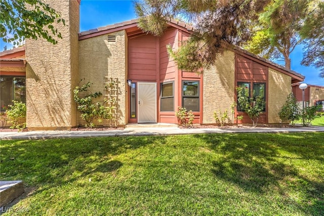 view of front of home with a front yard